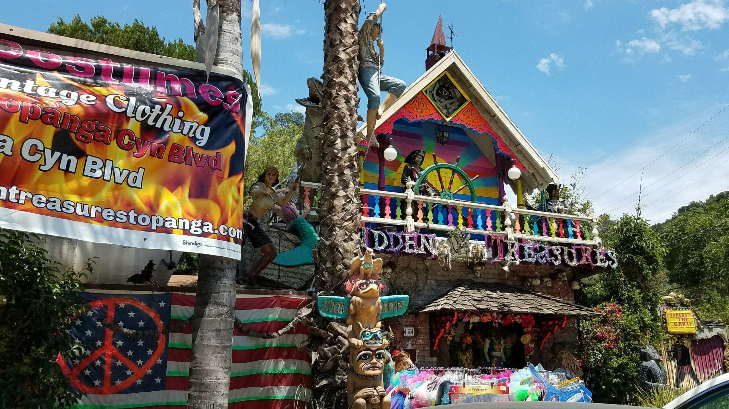 Colorful vintage shop decorated with eclectic sculptures and art.