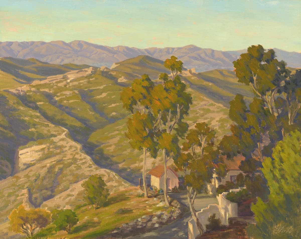 A scenic landscape featuring rolling hills, trees, and a small house against a mountain backdrop.