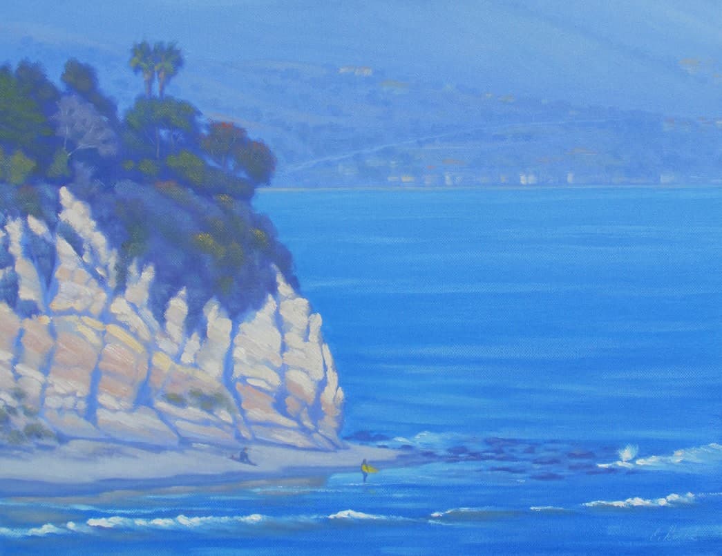 A serene coastal scene featuring a cliffside with palm trees overlooking calm blue waters.